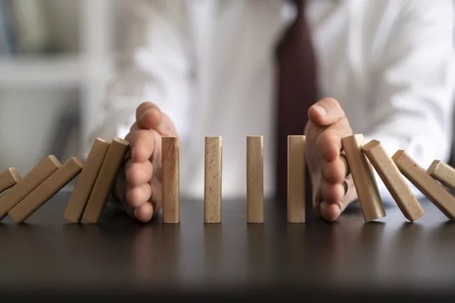 Man stopping domino effect of ERC claims