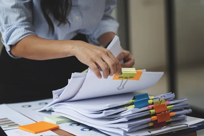 Woman gathers the supporting documents requested by the IRS
