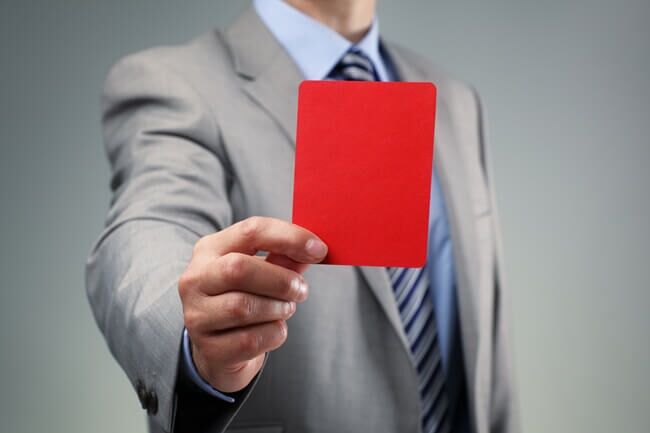 Tax Preparer Holds up a Penalty Card