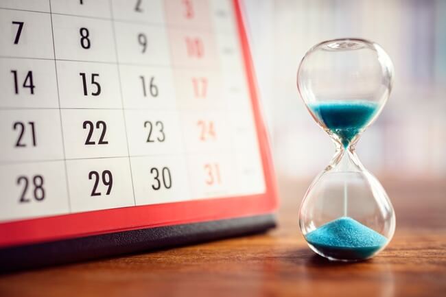 Hourglass and calendar marking the time until the IRS comes for unpaid taxes