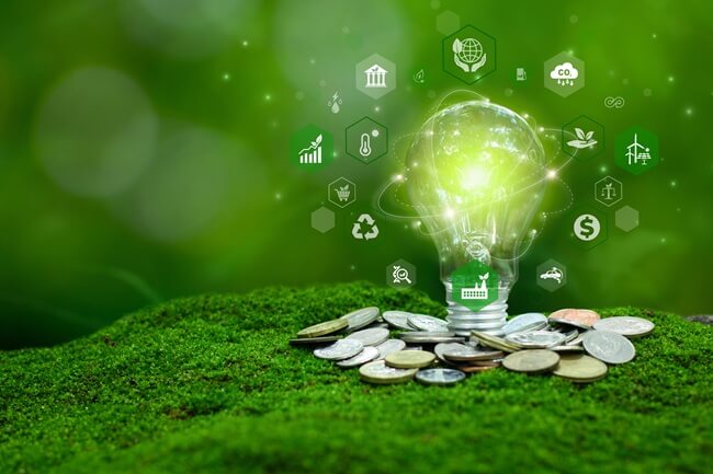 Lightbulb with green energy consideration graphics surrounding it