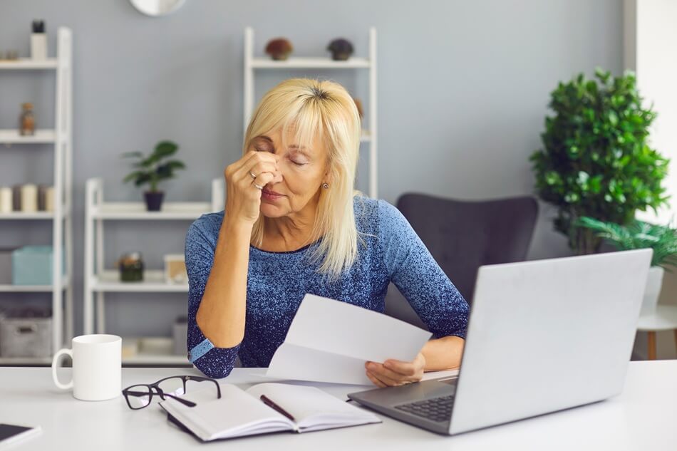 Woman receives Tax Credit Denial notice from the IRS